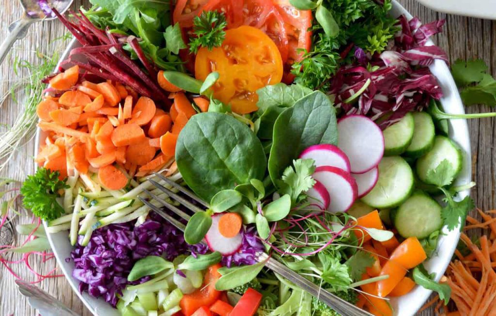 A large bowl of fresh salad and vegetables