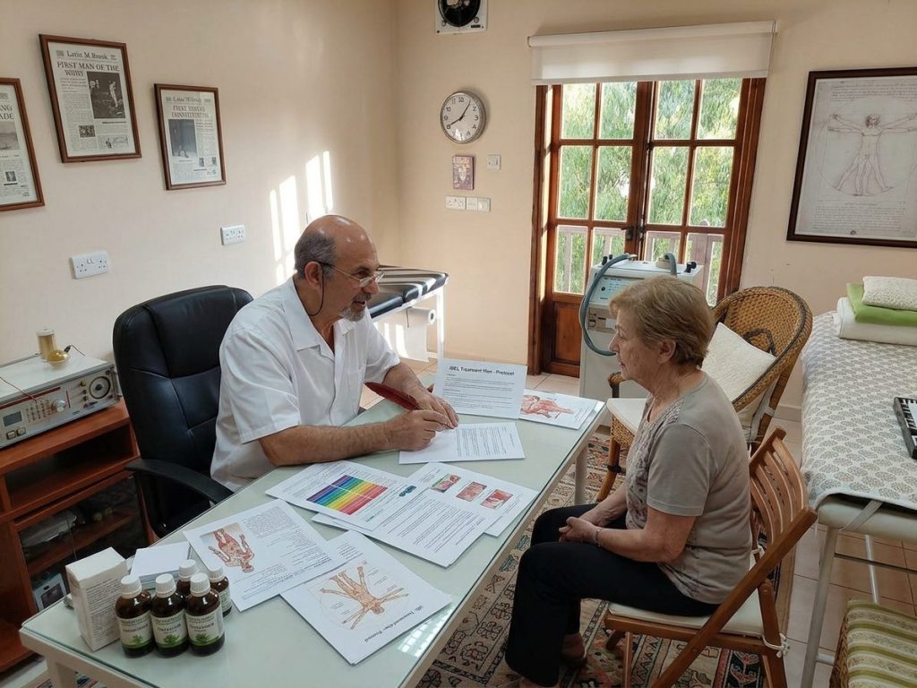 Dr. George Georgiou going through a patient’s results with her